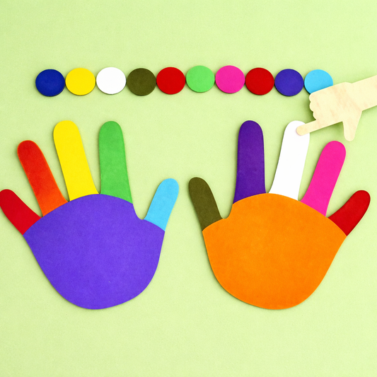 Colorful hand-shaped cutouts with a rainbow of dots on a light green background