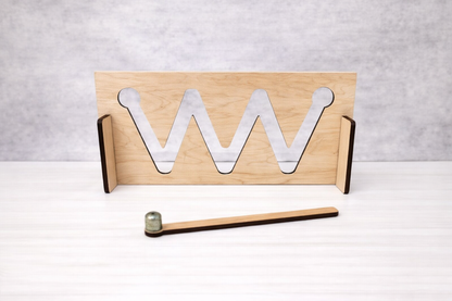 Wooden stand with metal 'W' letters on a white surface